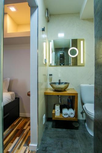 a bathroom with a sink and a toilet at Oceanway Apartment in the Center of Baleal in Ferrel