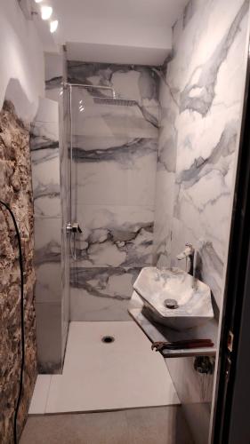 a bathroom with a shower and a sink at Camping Ripolles in Ripoll