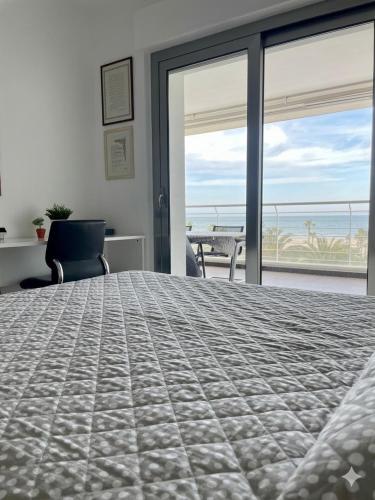 a bedroom with a large bed with a view of the ocean at RIVIERA PALACE - BILO SEA FRONT- Premium Villas in Giulianova