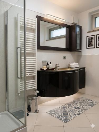 a bathroom with a sink and a mirror at RIVIERA PALACE - BILO SEA FRONT- Premium Villas in Giulianova