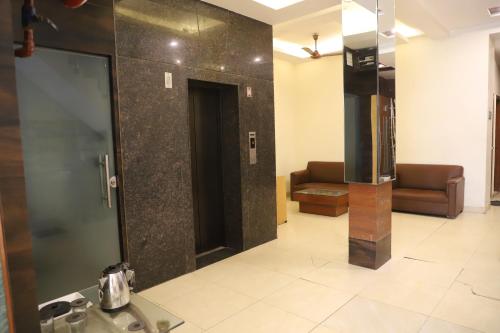 a bathroom with a sink and a mirror at Hotel Lav Kush Deluxe 2 Min Walk From New Delhi Railway Station in New Delhi