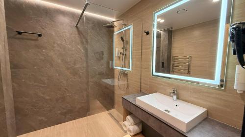 a bathroom with a sink and a shower at Готель Гоголь in Poltava