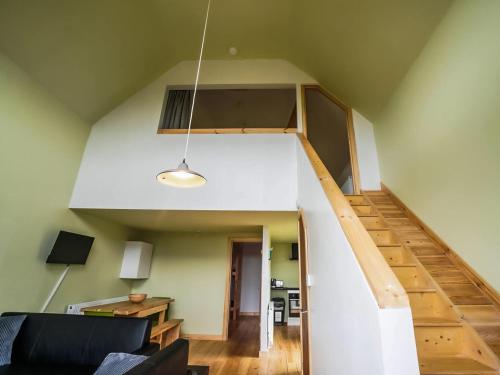 a living room with a staircase in a house at Mercury 5 - Uk50475 in Greenhaugh
