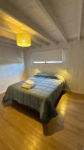 a bedroom with a bed in a room at Stone Tiny Chalten Nordic Cabin Patagonia - Arg in El Chalten