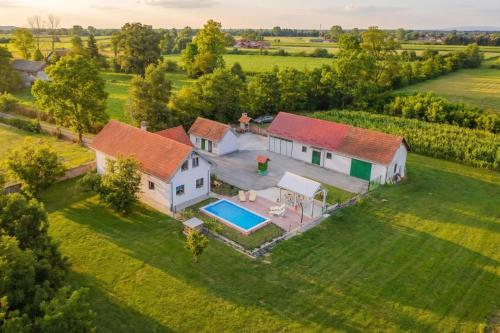 an aerial view of a house with a swimming pool at Green Oasis Estate with Private Pool and Backyard near Zagreb in Velika Gorica