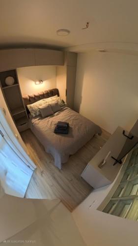 a bedroom with a bed in a room at Harmony Shore Apartments in Palanga