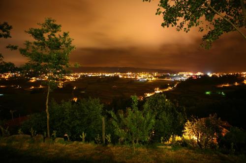 a view of a city at night at Quinta da Costa in Lixa