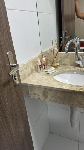 a bathroom counter with a sink and a mirror at Hotel Pedra da Letra in Mauriti