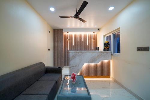 a living room with a couch and a table at Open Hotel by Olive - Urban Suites in Bangalore