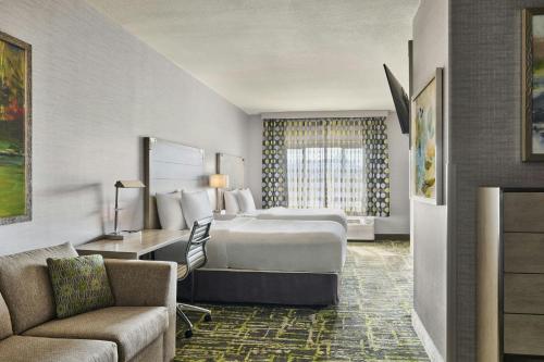 a hotel room with a bed and a couch at SpringHill Suites Prescott in Prescott