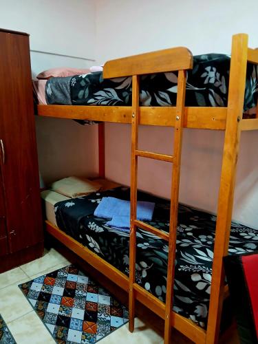 a couple of bunk beds in a room at Departamento J&J 2 in Aristóbulo del Valle