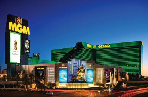a group of buildings in a city at night at MGM Grand in Las Vegas