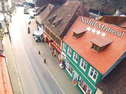 a model of a building in a city with a street at Pensiunea Nobil Medieval in Sighişoara