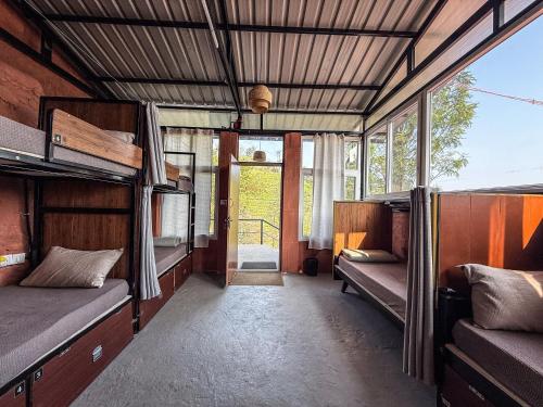 an empty room with two bunk beds in a train at Mad & Nomad Backpackers Hostel in Coonoor