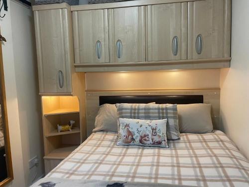 a small bedroom with a bed with a pillow on it at Field View 162a fifth Ave in Bridlington