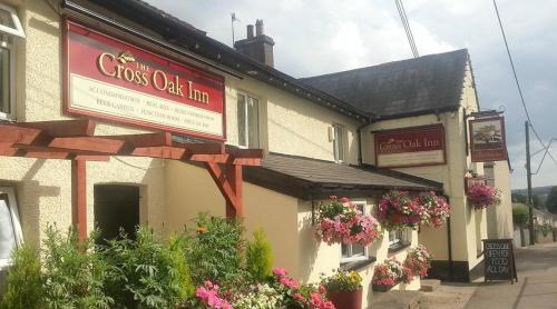 a building with a sign that reads crooks oak inn at The Cross Oak Inn in Blackwood