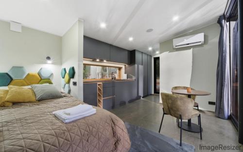 a bedroom with a bed and a table in it at Luxury Resort Päikeseoru in Pedajamäe
