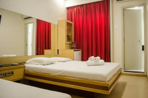 Voodi või voodid majutusasutuse Hotel Hostal (Adults Only) toas