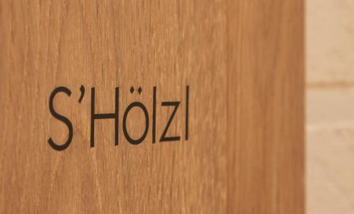 a wooden door with the word show on it at AlmRefugio in Neumarkt in der Oberpfalz