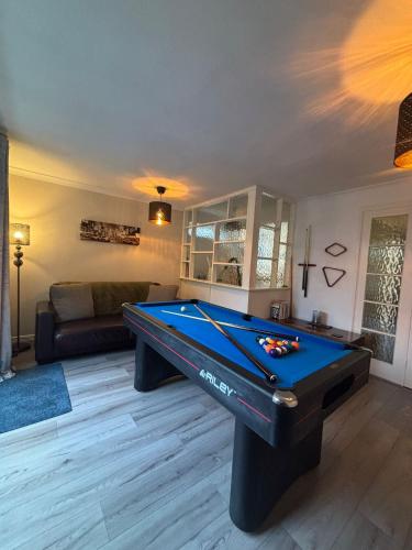 a living room with a pool table in it at Alverstoke Manor - family home with pool table in Alverstoke