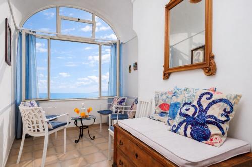 a living room with a couch and a table at A la casa del cavaliere in Positano