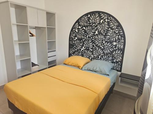 a bedroom with a bed and a black and white wall at Villa Capucine in Saint-Paul