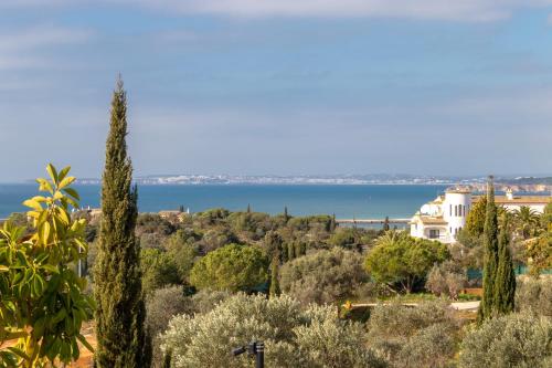 a view of the lake from a hill with trees at Villa Ocean Blue Ocean views Walk to beach Pool in Ferragudo