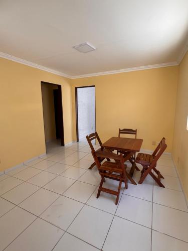 a dining room with a table and two chairs at Casa Freire in Maceió