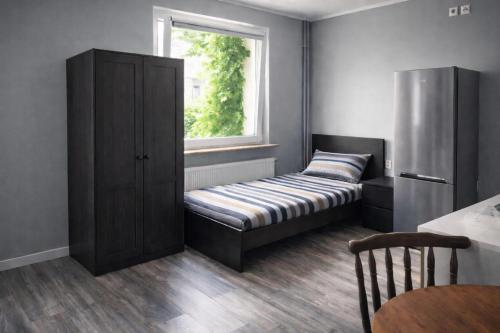 a room with a bench in front of a window at Apartments in Leuna in Leuna