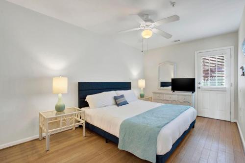 a bedroom with a bed and a ceiling fan at Tybee Turtle in Tybee Island