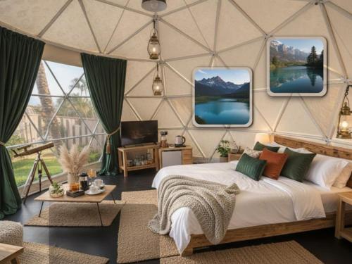 a bedroom with a bed and two monitors on the wall at Wisdom Park Pattaya near Tomorrowland Thailand in Ban Khao Mai Kaeo