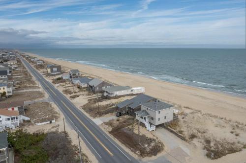an aerial view of a beach with houses and a road at 5061 - Good Night Irene in Kill Devil Hills