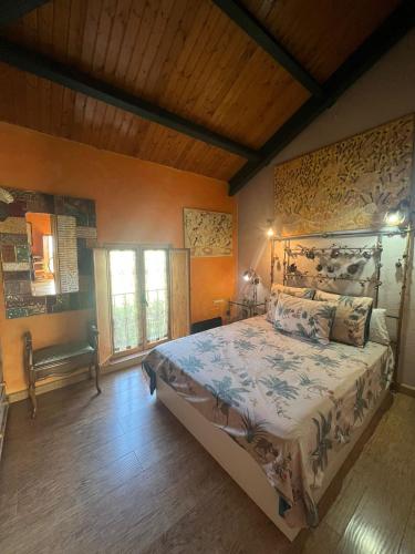 a bedroom with a large bed in a room at Casa del arco in Tarilonte