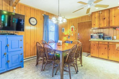 a kitchen with a dining room table and chairs at 7602 - Drydock in Avon