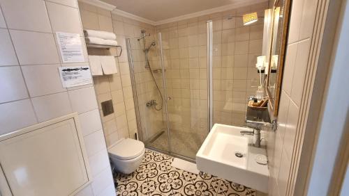 a bathroom with a shower and a sink and a toilet at Venue Hotel Istanbul Old City in Istanbul