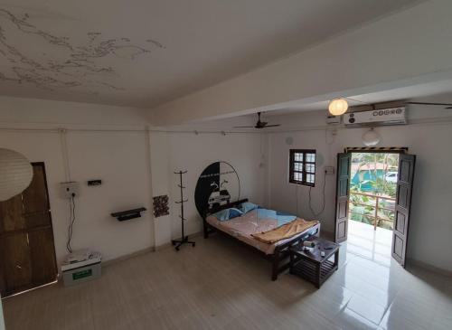 a room with a bed and a table in it at House 21 - Mid in Querim