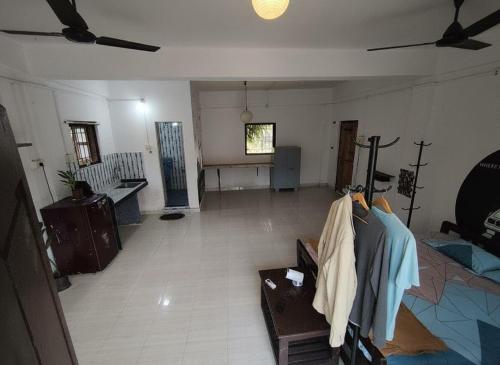 a living room with a couch and a table at House 21 - Mid in Querim
