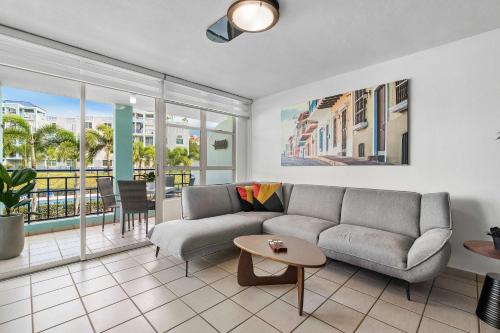 a living room with a couch and a table at Costa Brava Condo by Otium in Ceiba