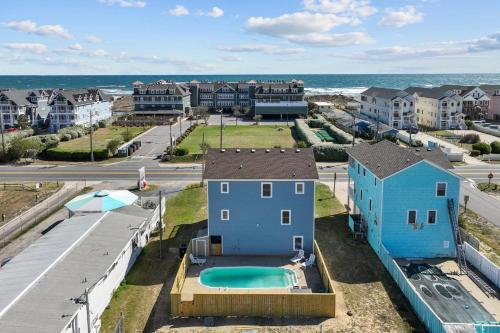 an aerial view of a house with a swimming pool at 5319 - Day Dreamz in Kill Devil Hills