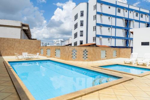a swimming pool on the roof of a building at Shalako Hotel in Vitória da Conquista