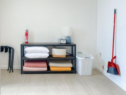 a shelf with towels and a basket in a room at Wilder Bunkhouse in De Smet