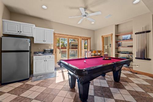 a kitchen with a pool table in a room at 3947 - Leg-O Duck in Duck