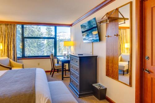 a hotel room with a bed and a desk and a desk at Everline Resort Studio w/ Luxury Resort Perks in Olympic Valley