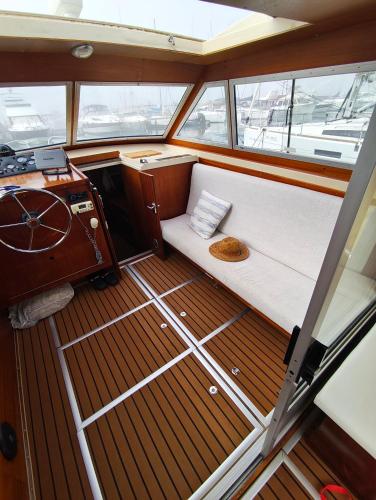 a small boat with a bed on the deck at Jeddah in Izola