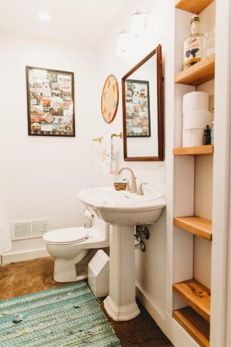 a bathroom with a sink and a toilet at Charming Cottage w Hot Tub in Myers Airport