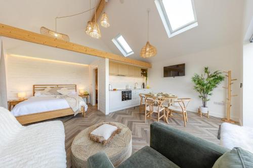 a bedroom with a bed and a dining room at 1 Bed in Llanmorlais oc-p35002 in Penclawdd