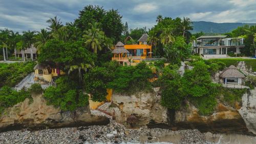 an aerial view of a house on a cliff at Casa Tara Villa Oceanfront Oasis Private Beach in Cruz de Huanacaxtle