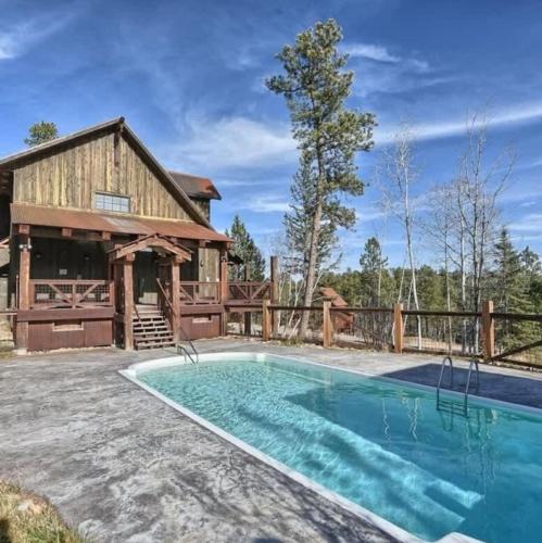 a house with a pool and a barn at The Great Escape in Lead