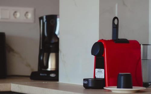 a toaster sitting on a counter next to a plate at H residence 2 in Artemida