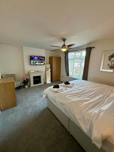 a bedroom with a bed with two cats laying on it at The Beach House in Mablethorpe